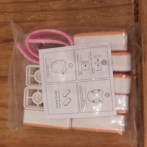 NIB (No Box) Orange and White TINAPPC Brand Toilet Seat Bumpers